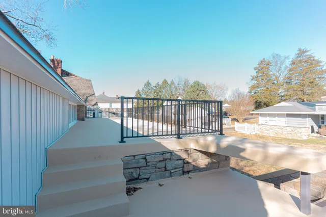 a view of balcony with wooden floor