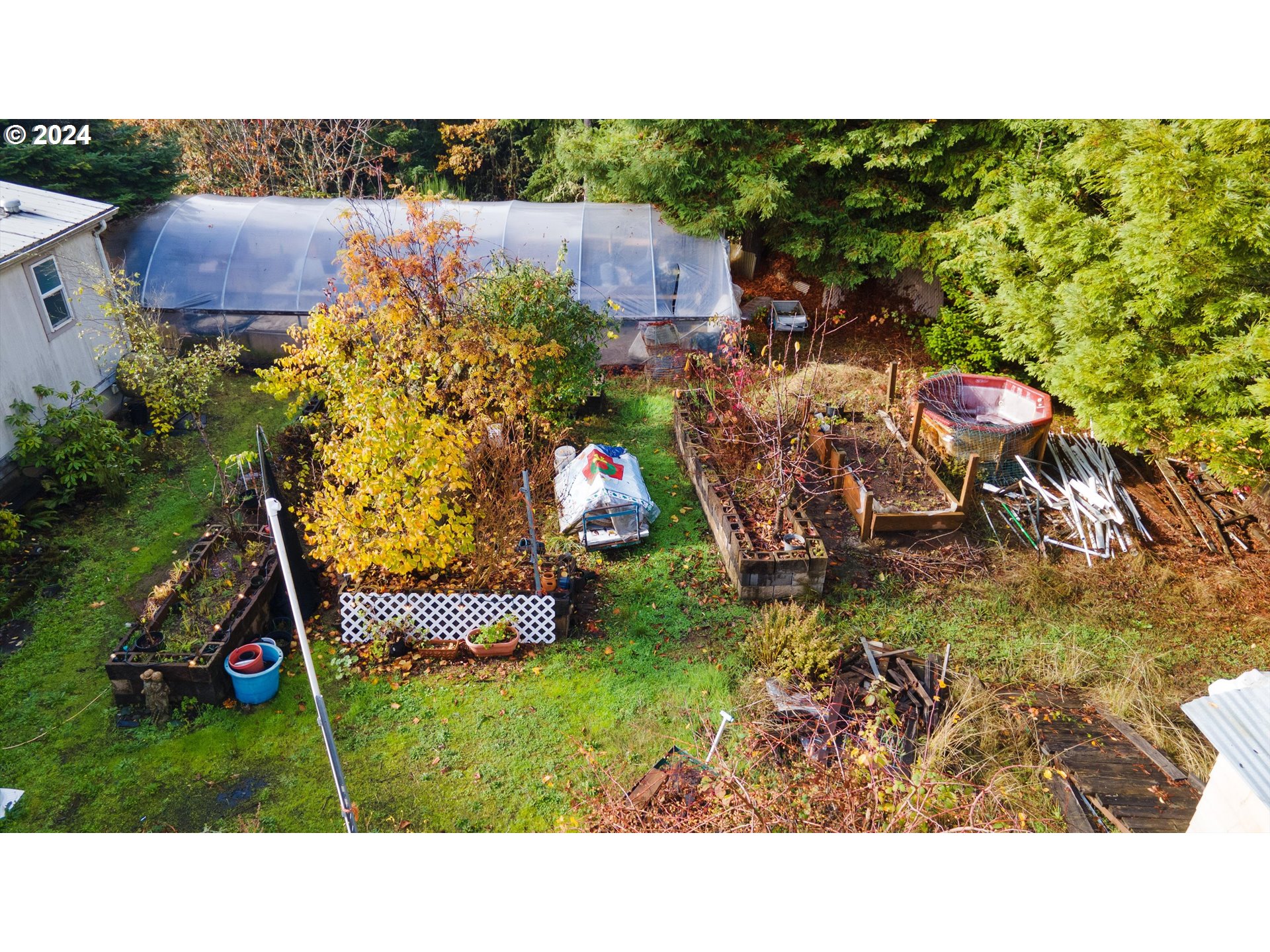1999 Pioneer Road Dallas, OR 97338 - Photo 11 of 25 a view of a backyard with table and chairs and potted plants