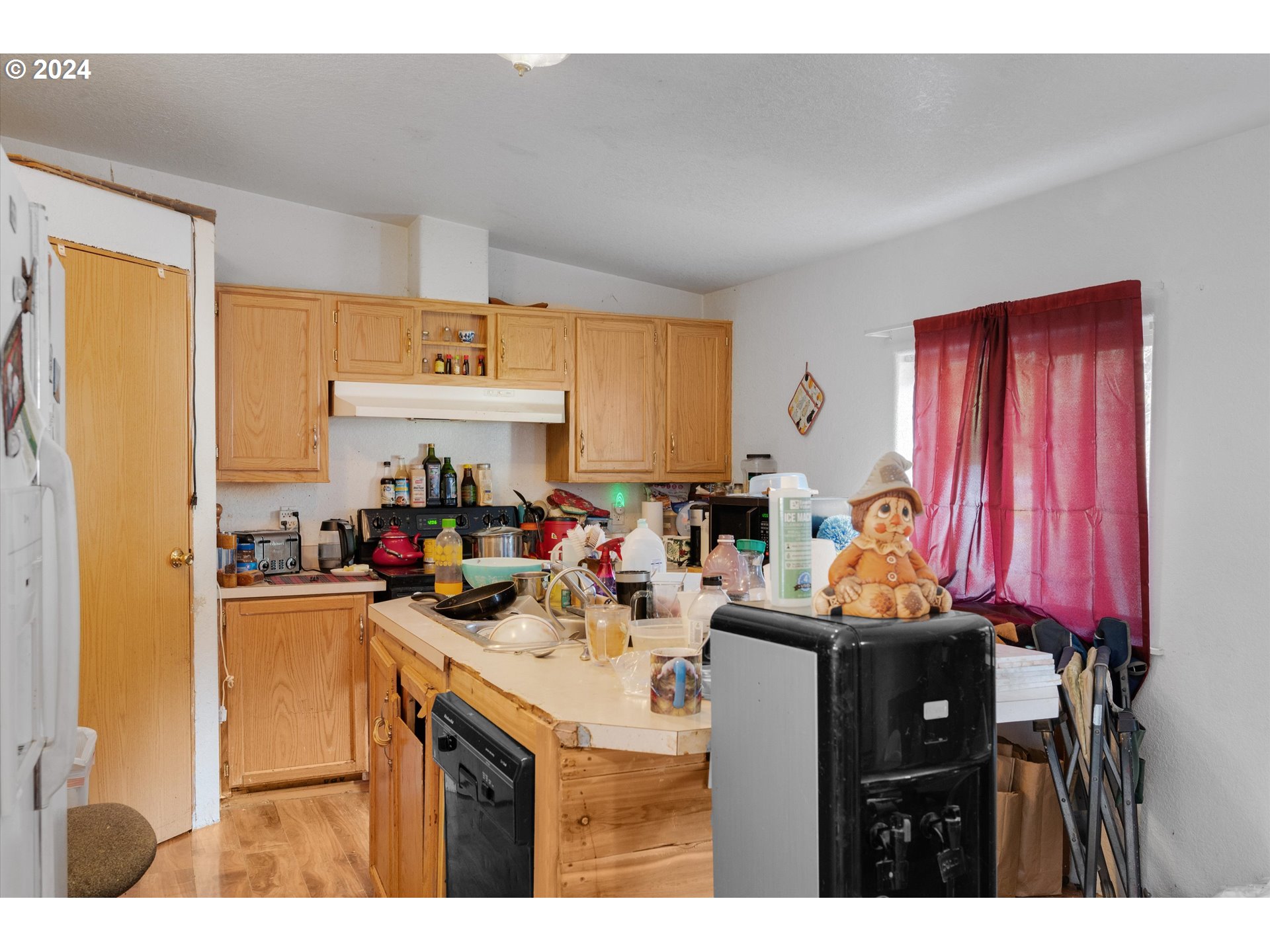 1999 Pioneer Road Dallas, OR 97338 - Photo 13 of 25 a kitchen with a sink a stove and a refrigerator