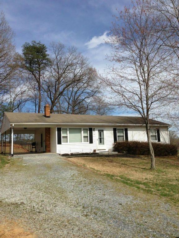 2746 Morgans Mill Road Goodview, VA 24095 - Photo 1 of 13 front view of a house with a yard