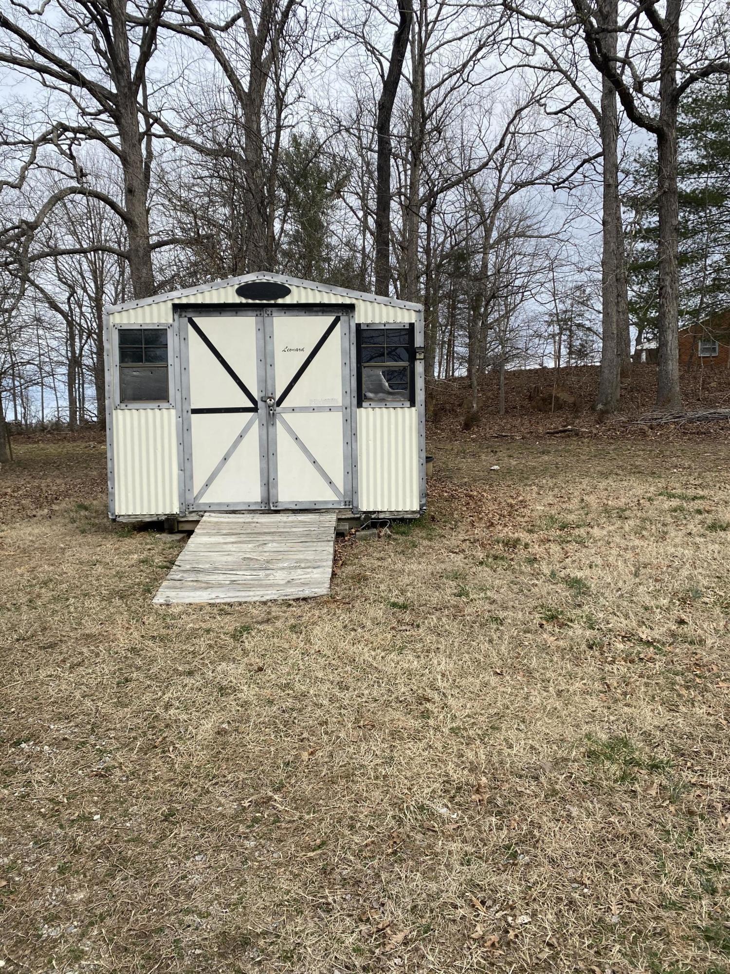 2746 Morgans Mill Road Goodview, VA 24095 - Photo 12 of 13 a view of a house with a yard