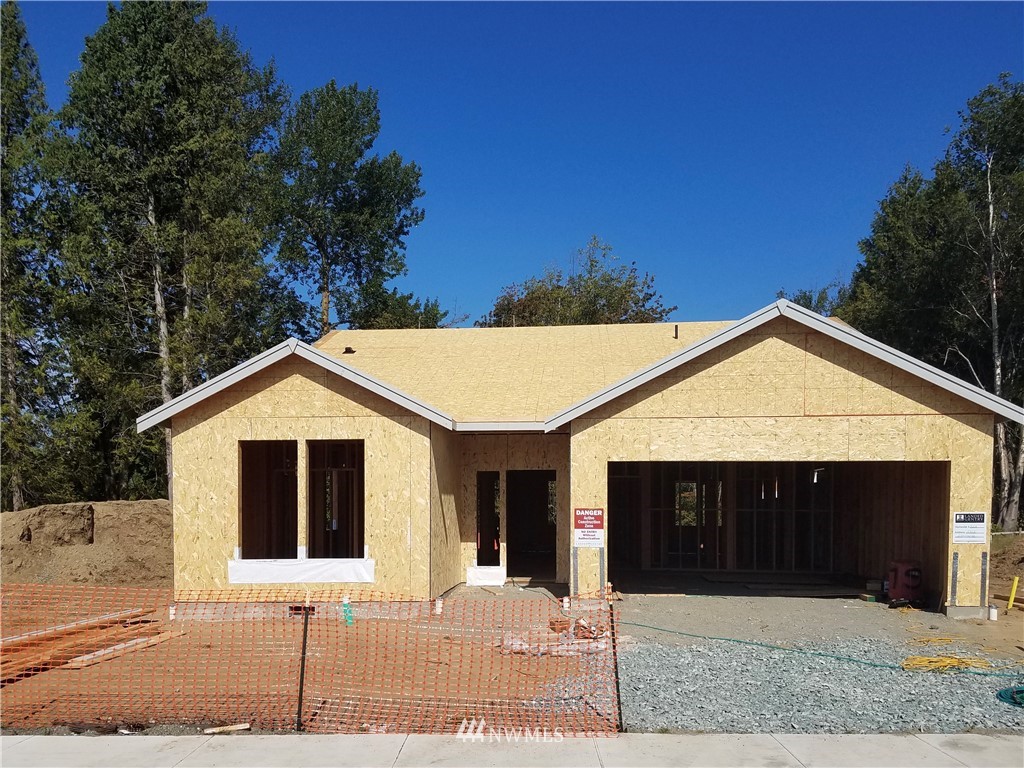 5463 Shields Road Ferndale, WA 98248 - Photo 2 of 17 a front view of a house with a yard and garage