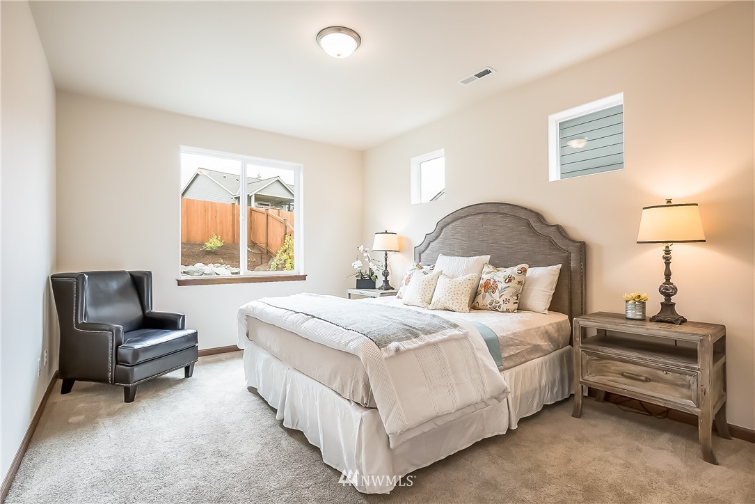 5463 Shields Road Ferndale, WA 98248 - Photo 16 of 17 a bedroom with a bed and a couch