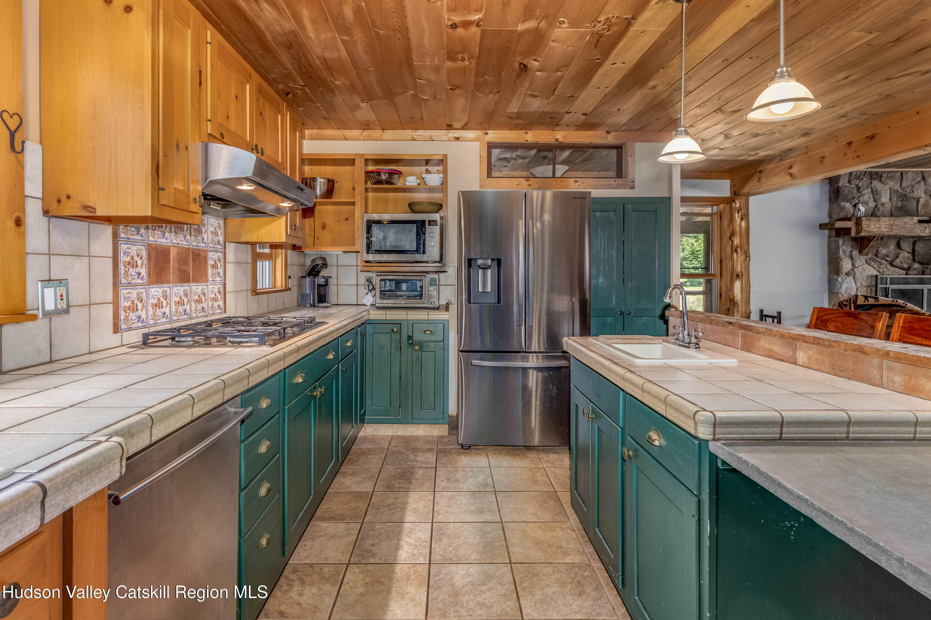 688 Bruce Porn Road Gilboa, NY 12167 - Photo 52 of 104 a kitchen with stainless steel appliances granite countertop a sink a counter top space and cabinets