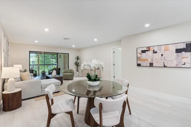 a view of a dining room with furniture window and outside view