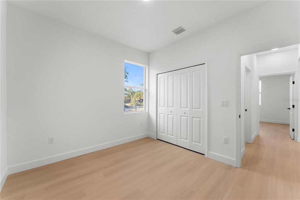2967 Barry Road North Port, FL 34286 - Photo 13 of 19 an empty room with windows