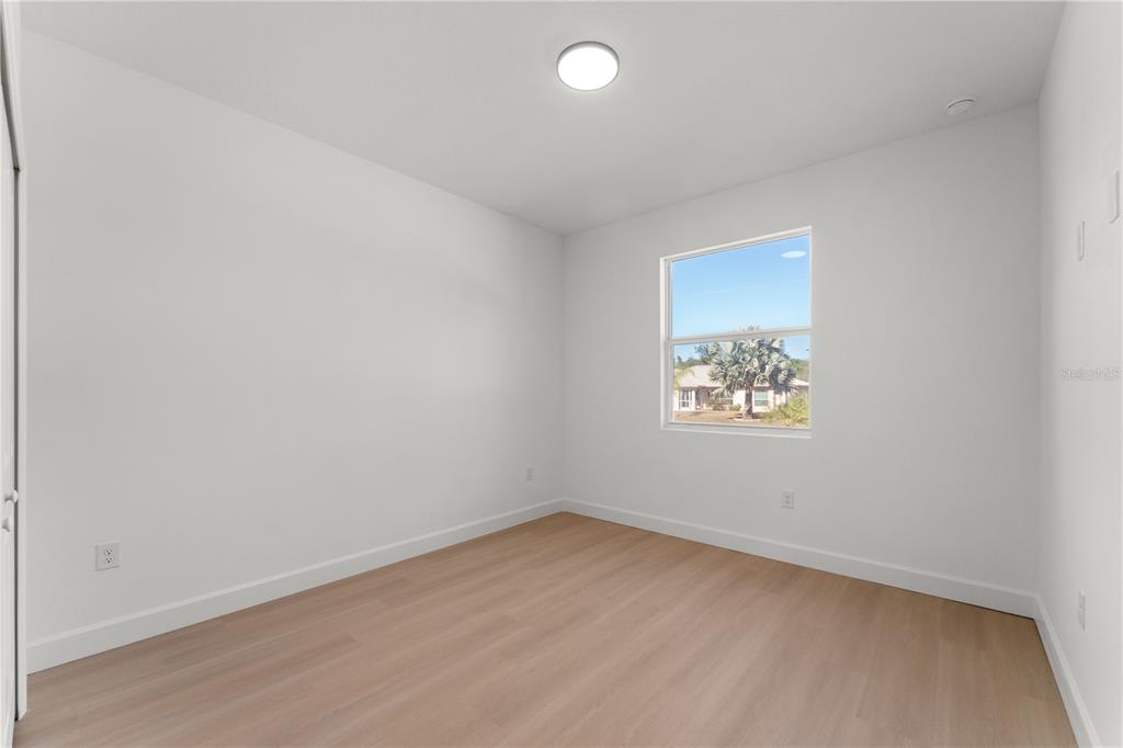 2967 Barry Road North Port, FL 34286 - Photo 14 of 19 an empty room with a window