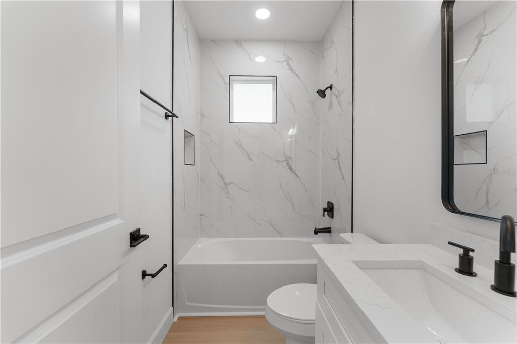 2967 Barry Road North Port, FL 34286 - Photo 15 of 19 a bathroom with a toilet sink and bathtub