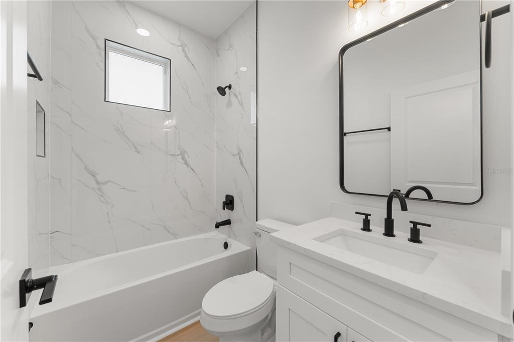 2967 Barry Road North Port, FL 34286 - Photo 16 of 19 a bathroom with a sink a toilet and a bathtub