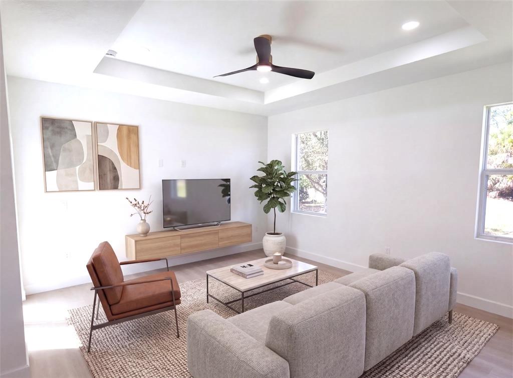 2967 Barry Road North Port, FL 34286 - Photo 3 of 19 a living room with furniture and a potted plant