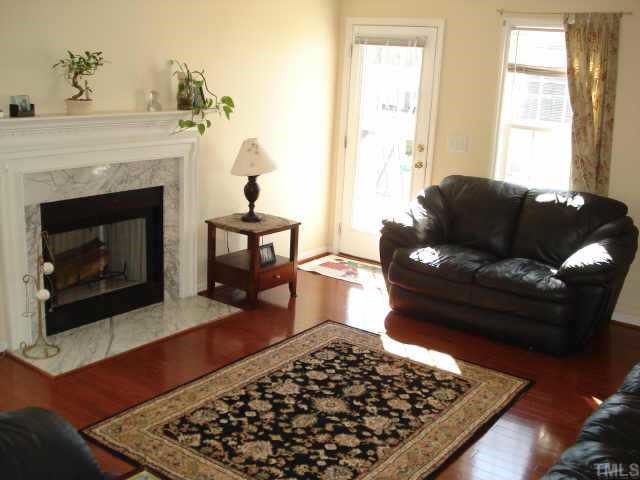 4105 Scofield Drive Raleigh, NC 27610 - Photo 3 of 7 a living room with furniture and a fireplace
