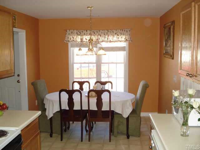 4105 Scofield Drive Raleigh, NC 27610 - Photo 6 of 7 a view of a dining room with furniture window and outside view