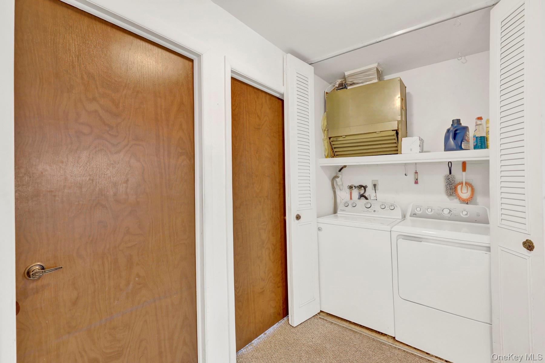 279 Berwick Court, Unit B Ridge, NY 11961 - Photo 11 of 13 a en suite bathroom with a sink and a mirror