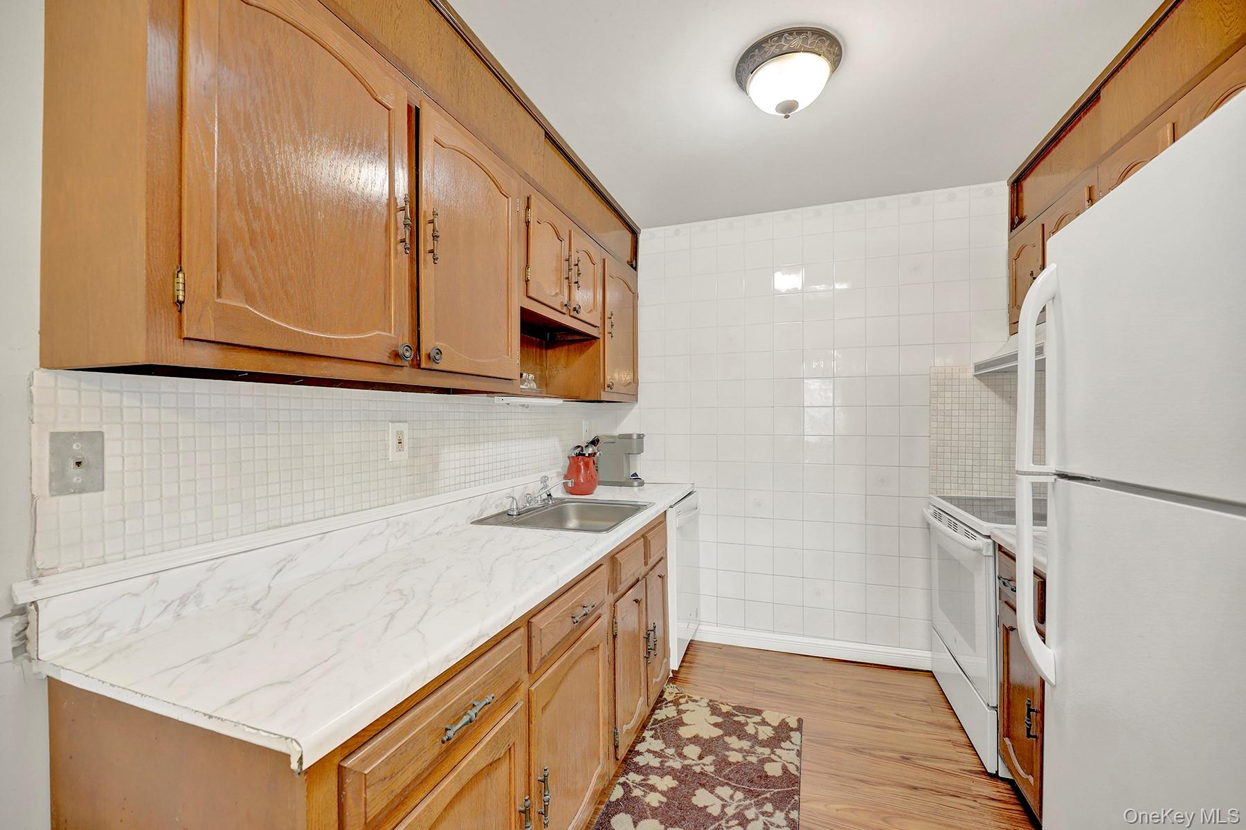 279 Berwick Court, Unit B Ridge, NY 11961 - Photo 3 of 16 Galley Kitchen
