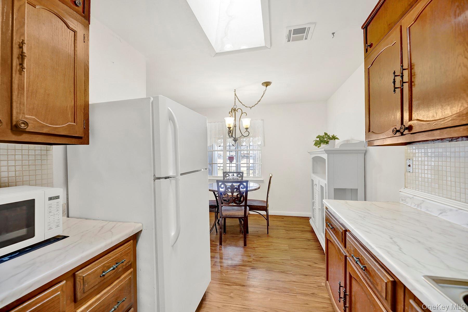 279 Berwick Court, Unit B Ridge, NY 11961 - Photo 4 of 16 Kitchen/Dining Area