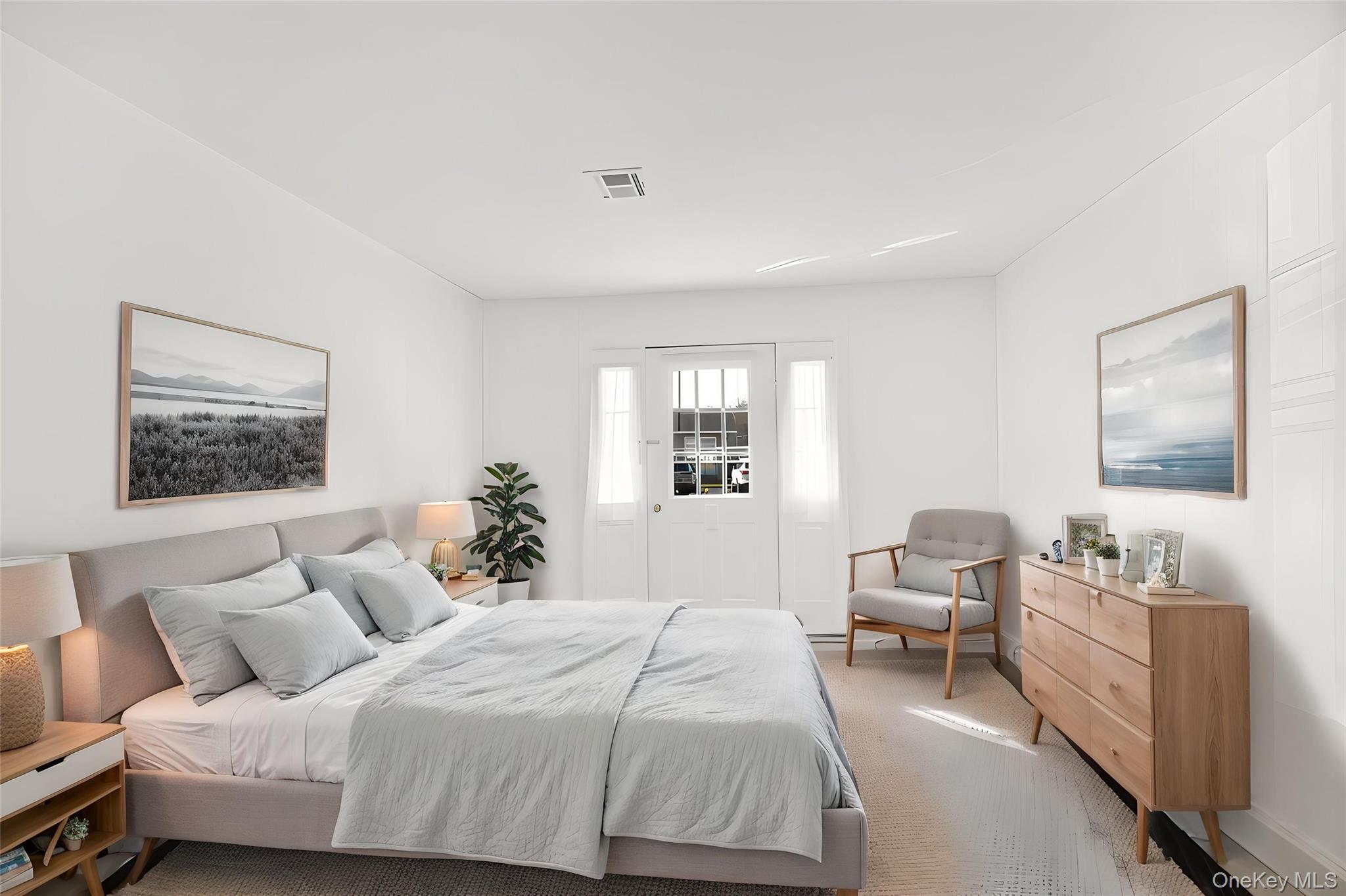 279 Berwick Court, Unit B Ridge, NY 11961 - Photo 8 of 13 a bedroom with a bed and a window