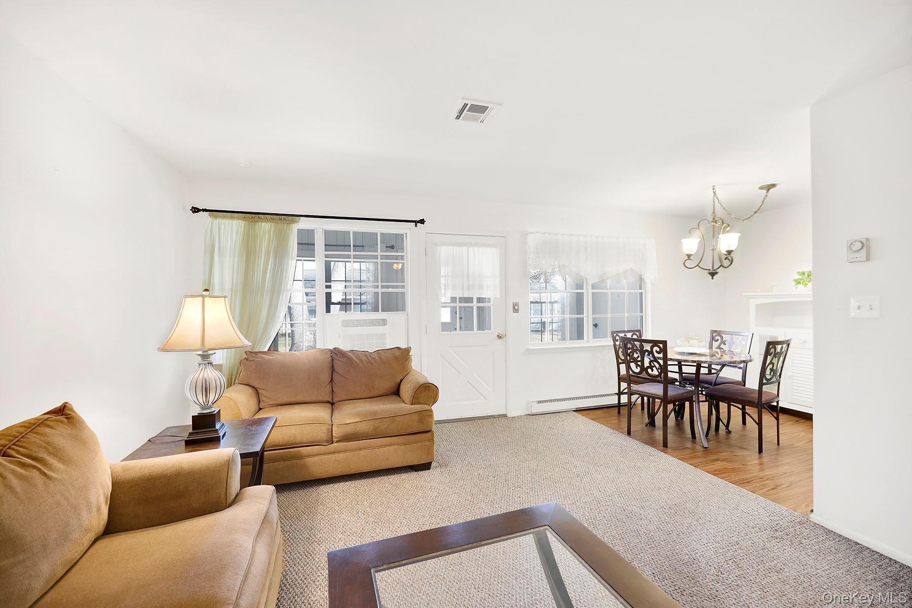 279 Berwick Court, Unit B Ridge, NY 11961 - Photo 9 of 16 Living Room/Dining Room