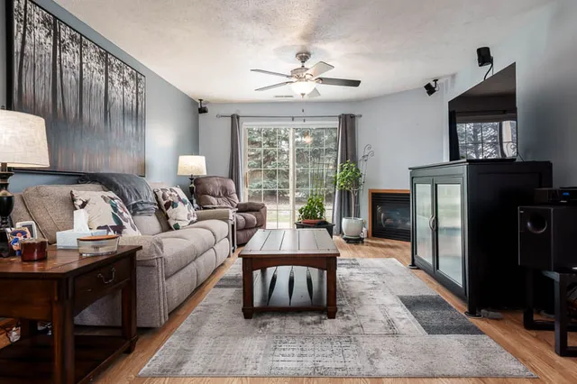 a living room with furniture and a large window