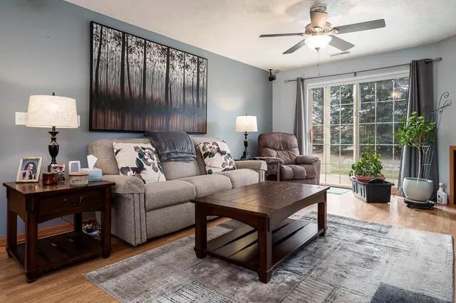 a living room with furniture and a large window