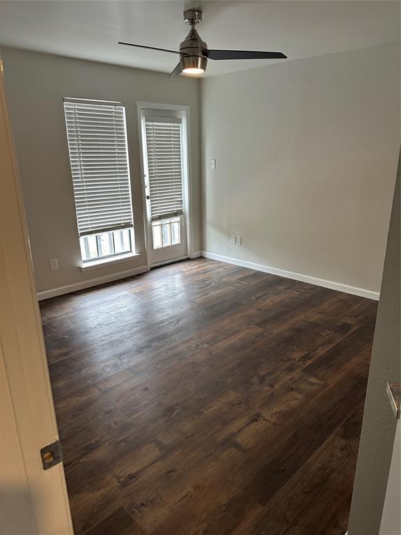 4520 Speedway, Unit A Austin, TX 78751 - Photo 2 of 10 wooden floor in an empty room with a window