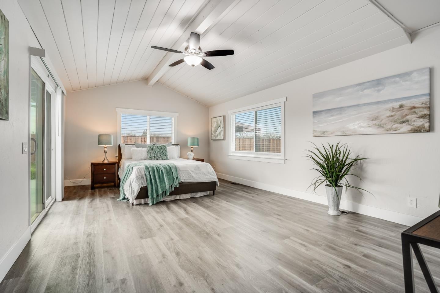 17675 Laurel Road Morgan Hill, CA 95037 - Photo 18 of 48 a bedroom with a bed and a chandelier