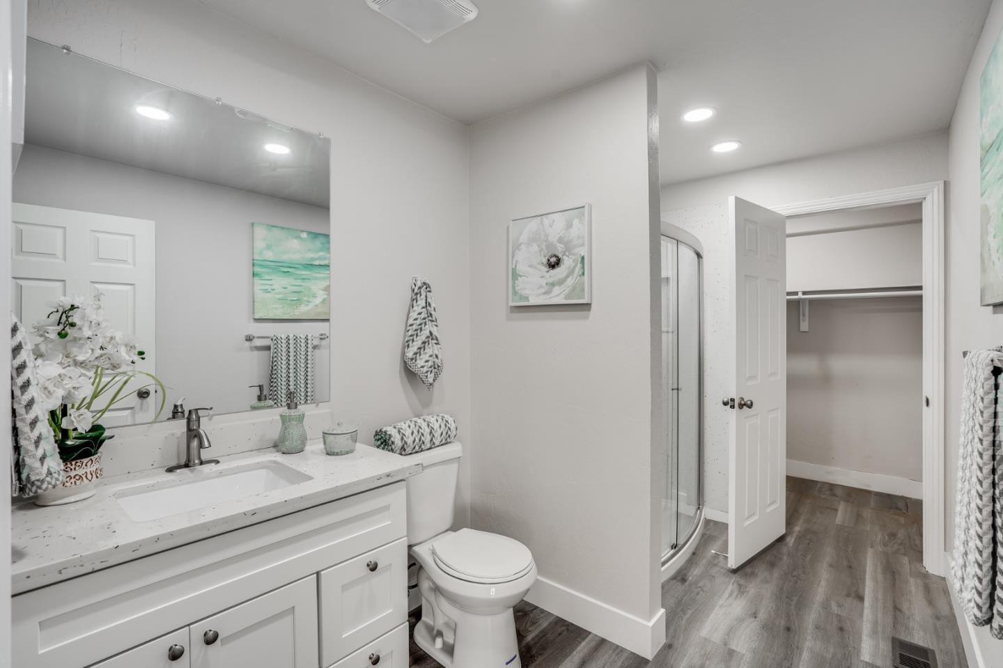 17675 Laurel Road Morgan Hill, CA 95037 - Photo 20 of 48 a bathroom with a double vanity sink toilet and shower
