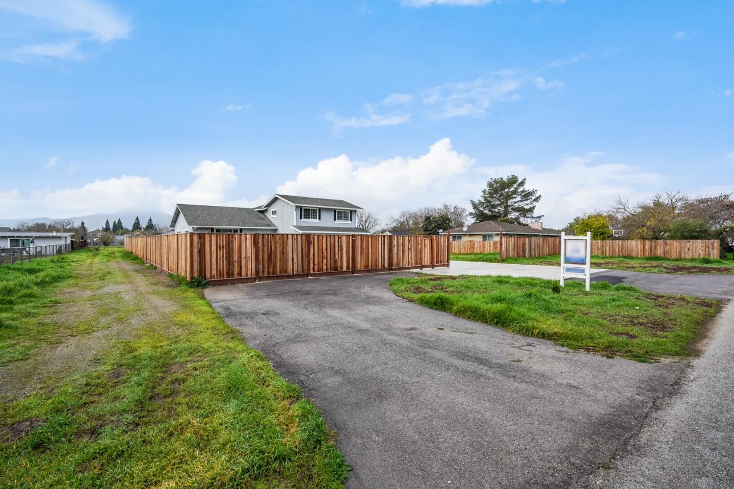 17675 Laurel Road Morgan Hill, CA 95037 - Photo 2 of 48 a view of a back yard with an tree and wooden fence