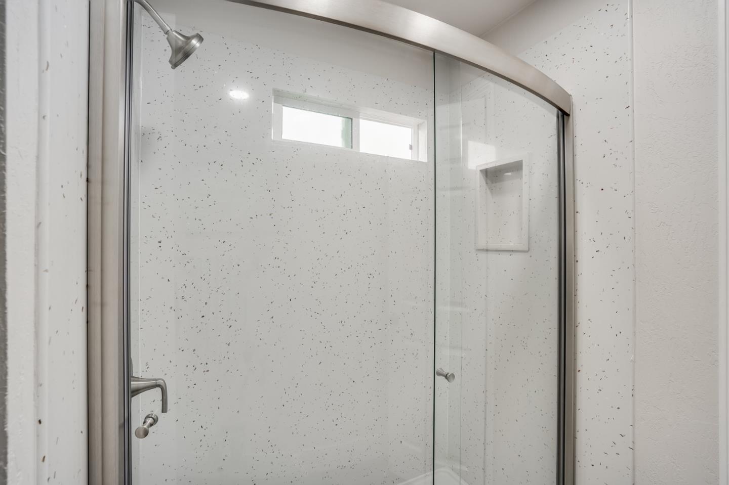 17675 Laurel Road Morgan Hill, CA 95037 - Photo 22 of 48 a bathroom with a glass shower door