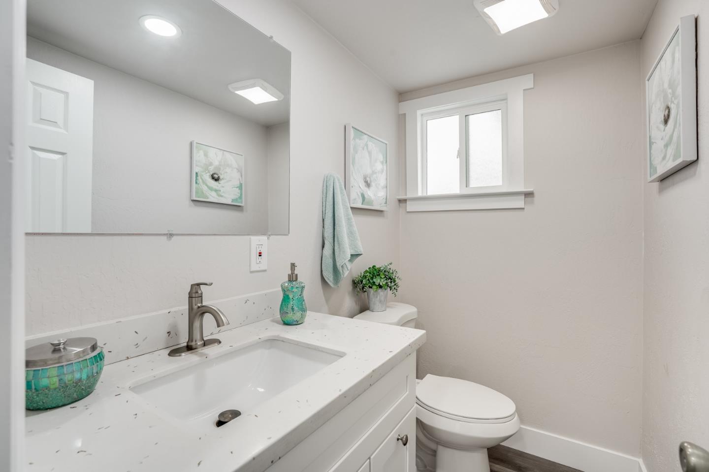 17675 Laurel Road Morgan Hill, CA 95037 - Photo 23 of 48 a bathroom with a sink toilet and mirror