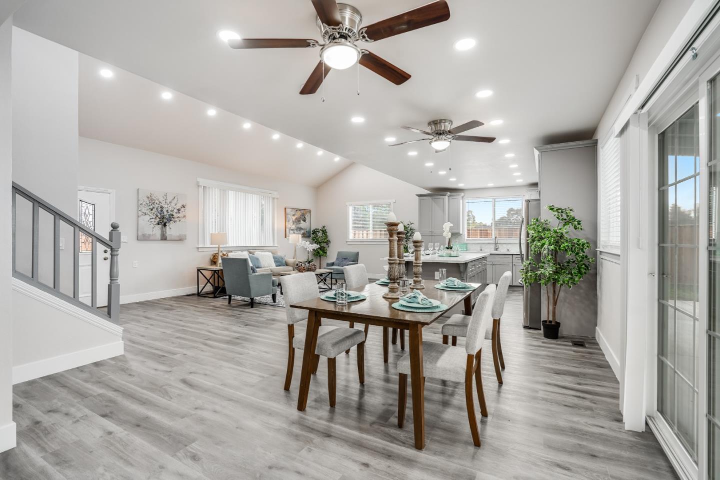 17675 Laurel Road Morgan Hill, CA 95037 - Photo 25 of 48 a dining room with wooden floor a chandelier a wooden table and chairs