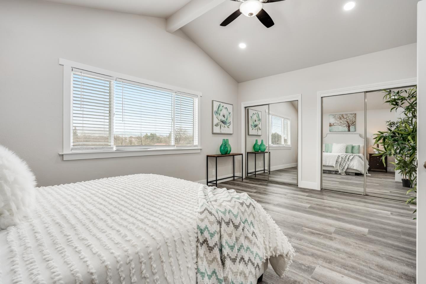 17675 Laurel Road Morgan Hill, CA 95037 - Photo 27 of 48 a spacious bedroom with a large bed and a large window