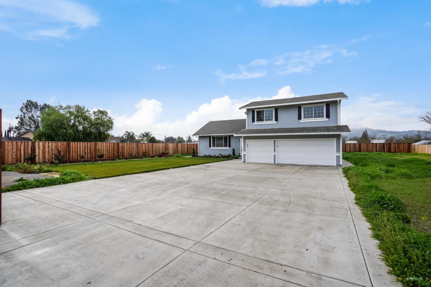 17675 Laurel Road Morgan Hill, CA 95037 - Photo 3 of 48 a front view of a house with a yard and garage