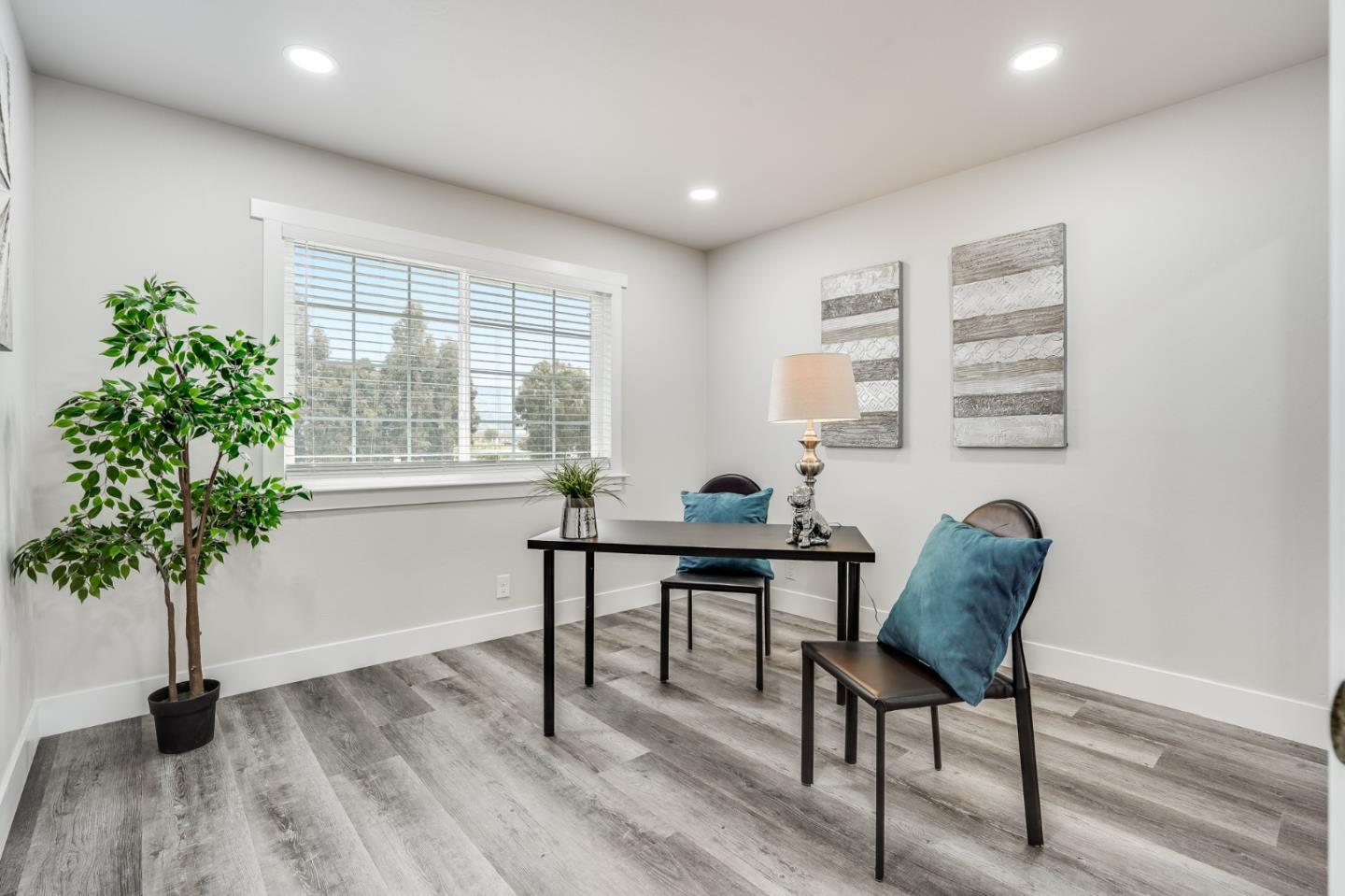 17675 Laurel Road Morgan Hill, CA 95037 - Photo 32 of 48 a view of a workspace with furniture and a potted plant