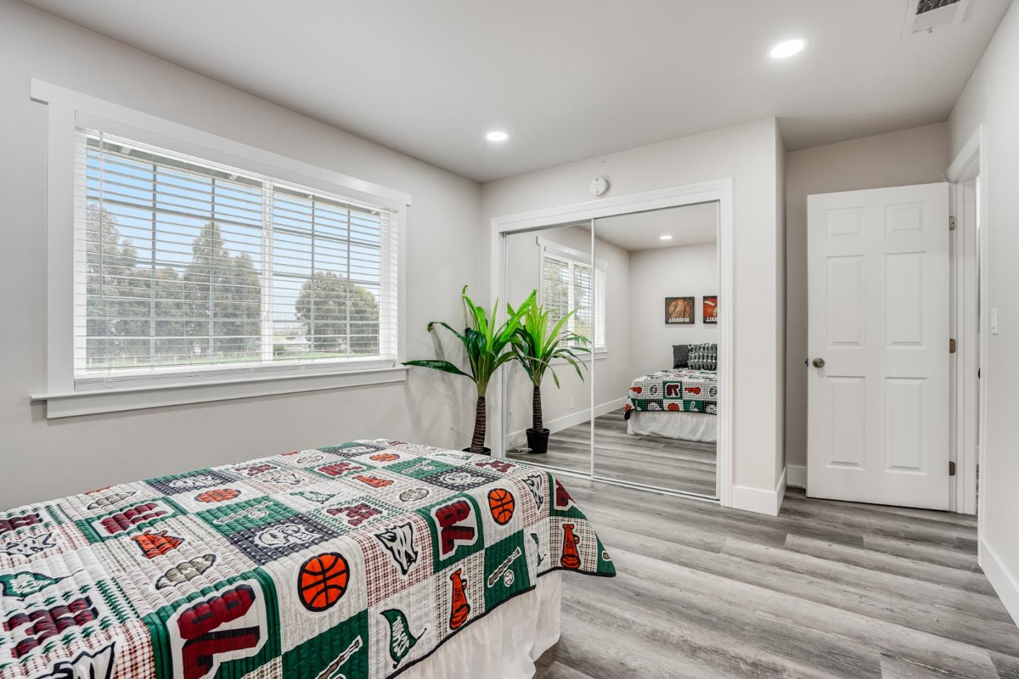 17675 Laurel Road Morgan Hill, CA 95037 - Photo 35 of 48 a bedroom with a bed and a potted plant