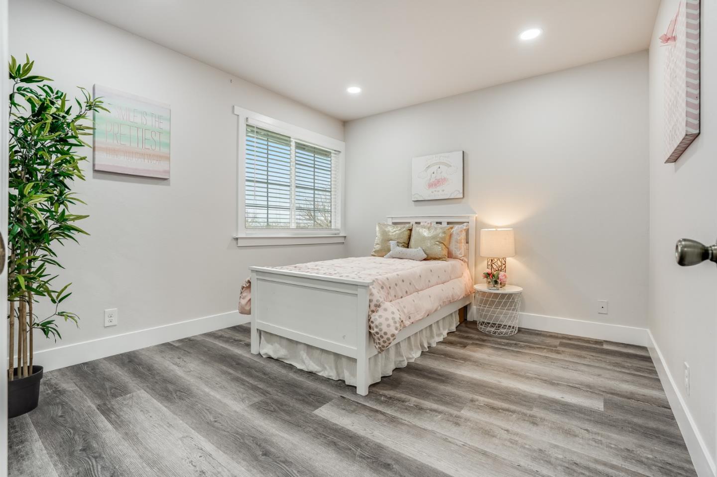 17675 Laurel Road Morgan Hill, CA 95037 - Photo 36 of 48 a bedroom with a bed and a potted plant