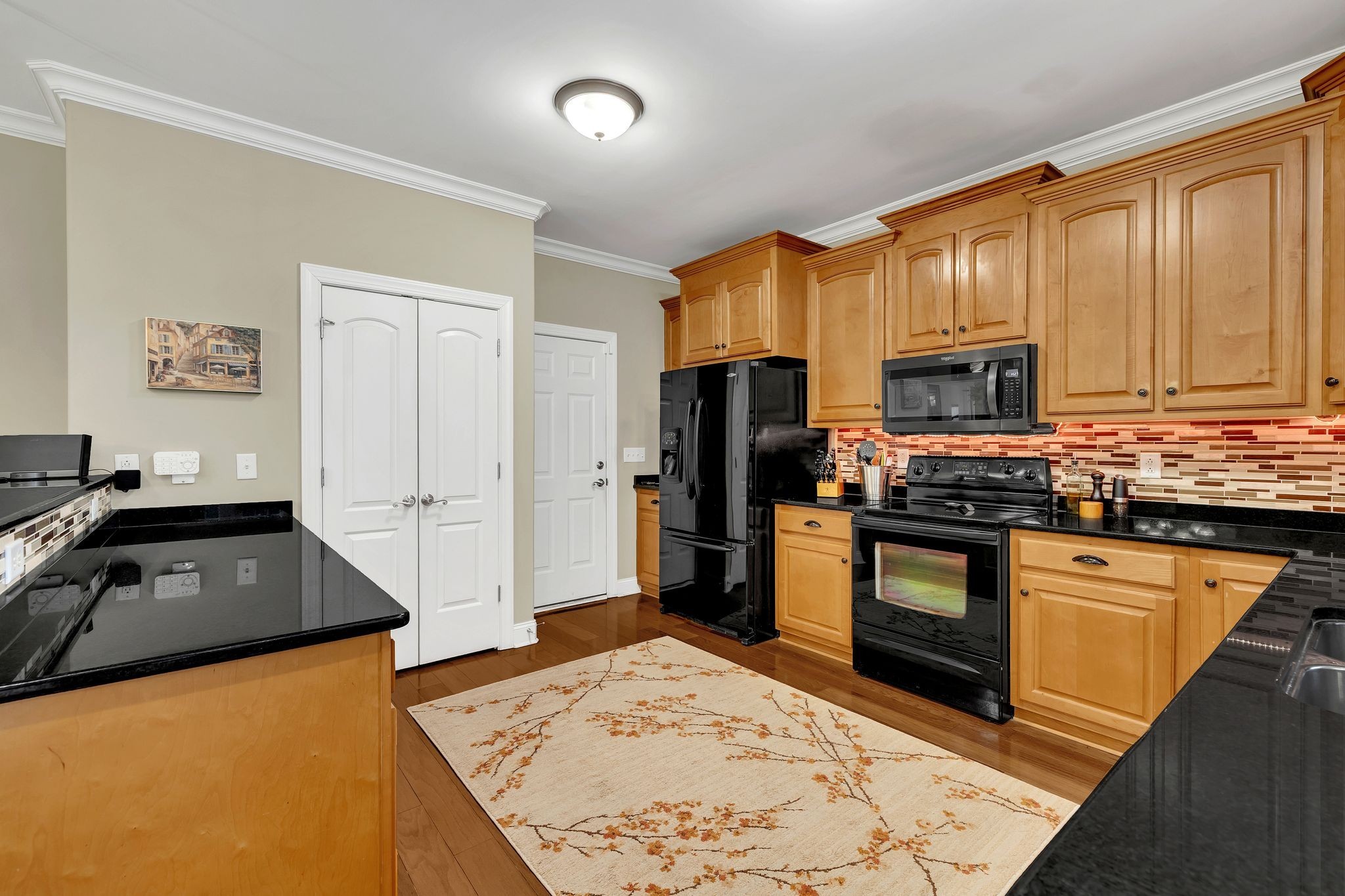 2009 Sunflower Drive Spring Hill, TN 37174 - Photo 20 of 34 a kitchen with granite countertop a refrigerator stove and sink