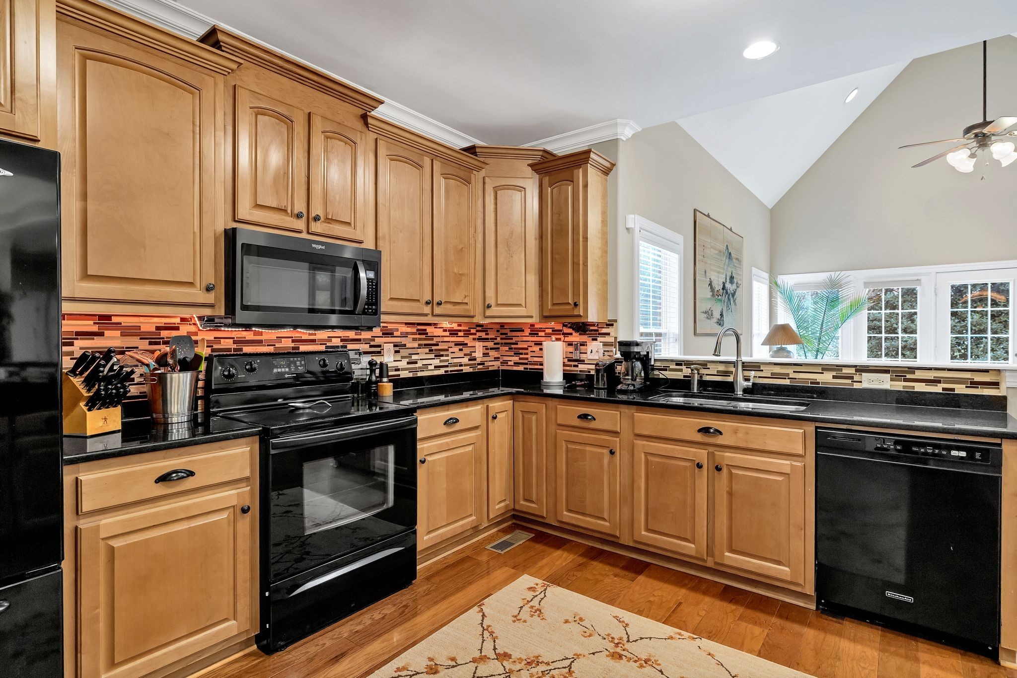 2009 Sunflower Drive Spring Hill, TN 37174 - Photo 22 of 34 a kitchen with stainless steel appliances wooden cabinets and a stove top oven