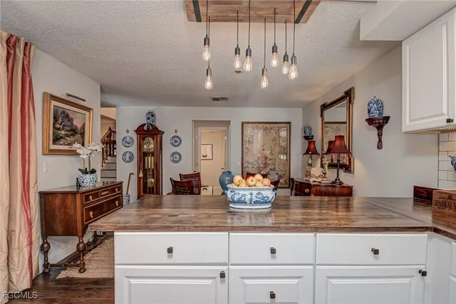 a kitchen with a counter space cabinets and appliances