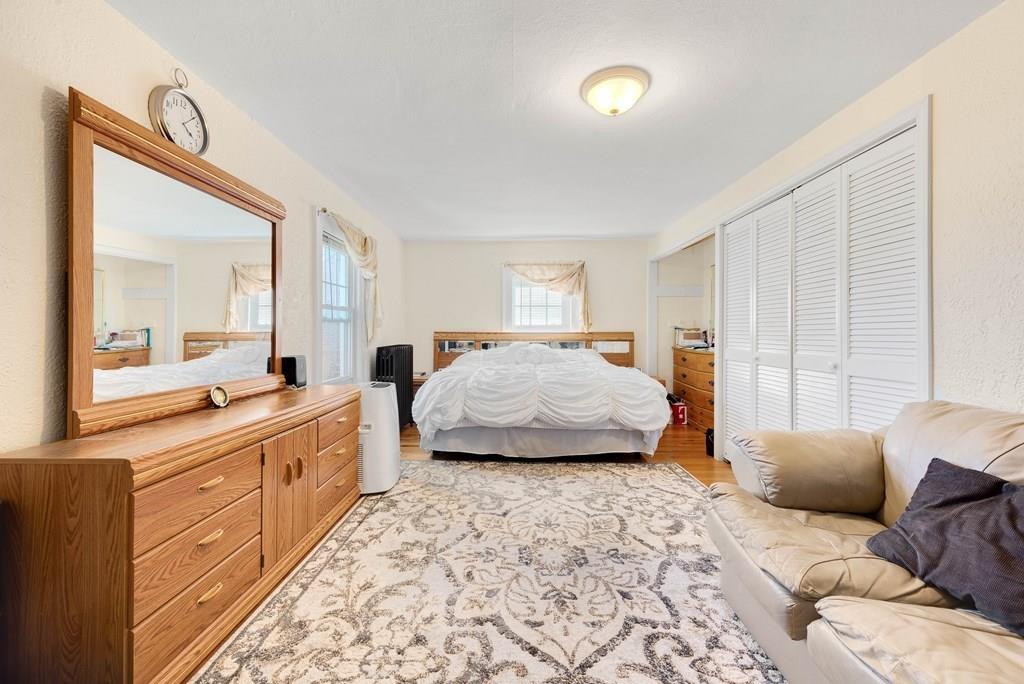 3 Silver Street Springfield, MA 01107 - Photo 15 of 20 a bedroom with furniture and a large mirror