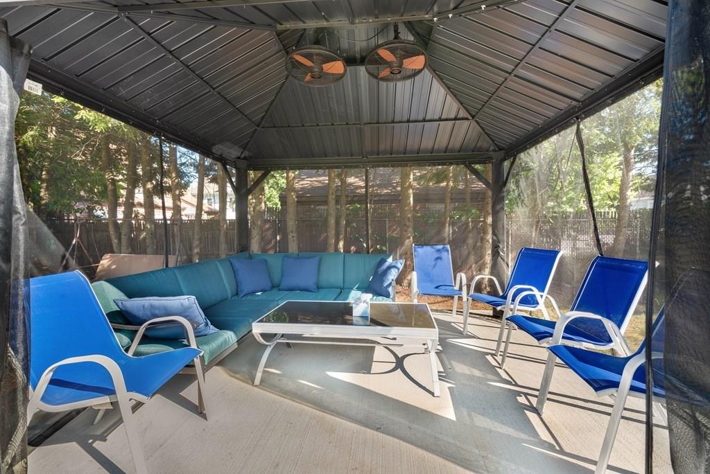 3 Silver Street Springfield, MA 01107 - Photo 8 of 20 a outdoor space with patio the couches and pool table with chairs and a umbrella
