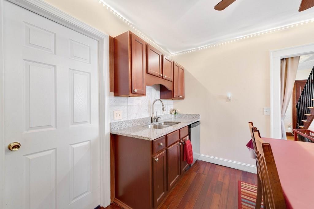 3 Silver Street Springfield, MA 01107 - Photo 10 of 20 a kitchen with a sink cabinets and a wooden floor