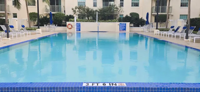 a view of swimming pool with outdoor seating