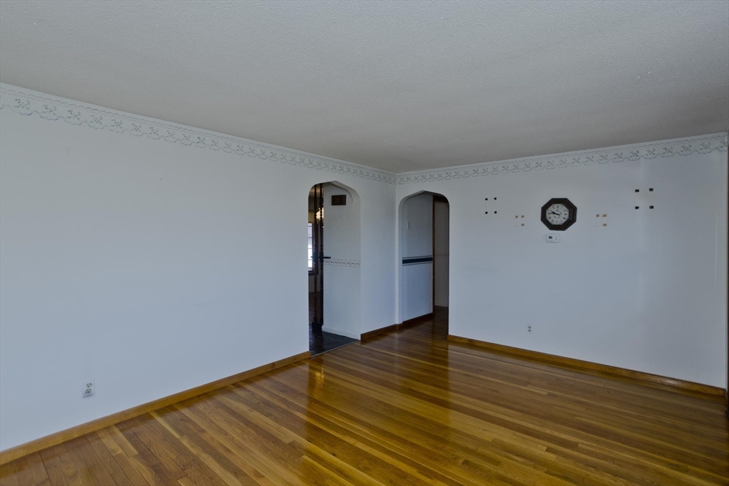 83 Mayflower Avenue Chicopee, MA 01013 - Photo 15 of 34 a view of an empty room with wooden floor