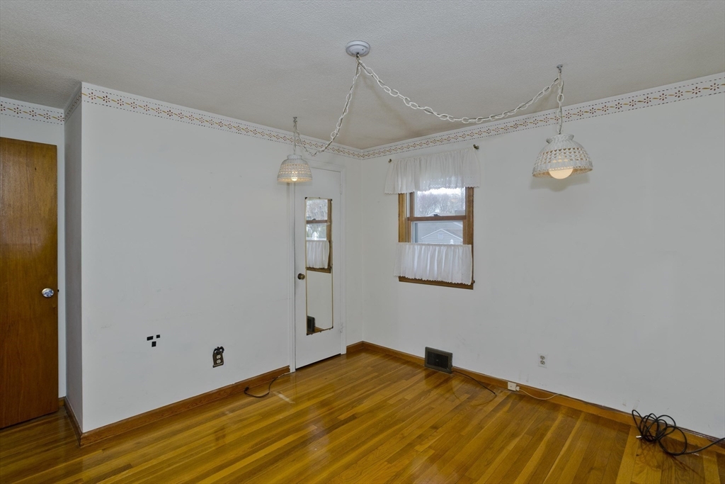 83 Mayflower Avenue Chicopee, MA 01013 - Photo 16 of 34 a view of a room with wooden floor and fan