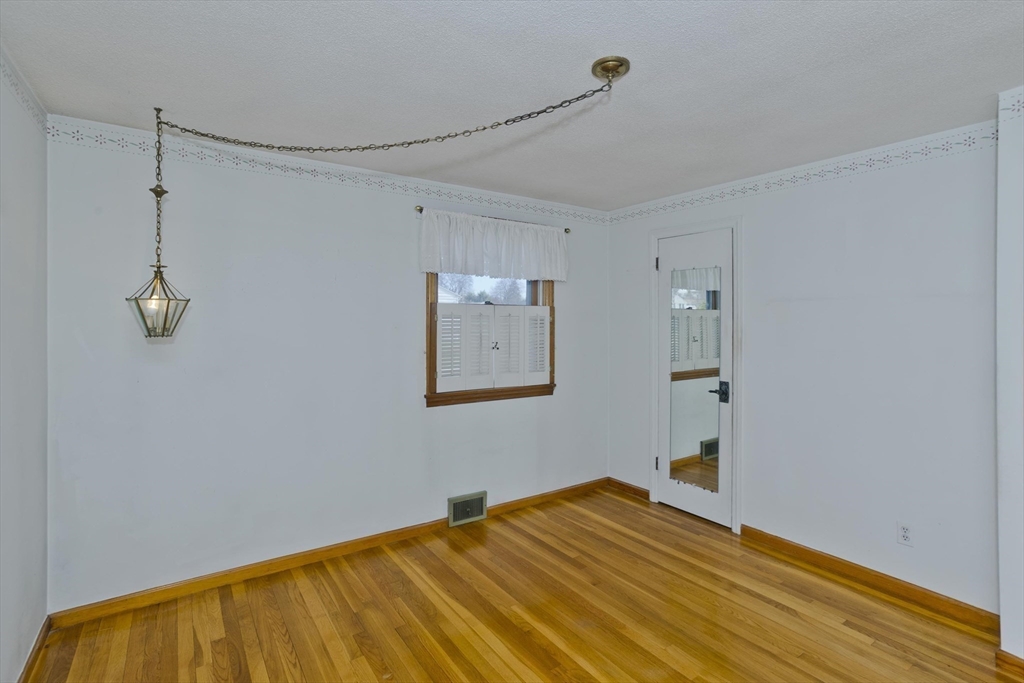 83 Mayflower Avenue Chicopee, MA 01013 - Photo 19 of 34 a bedroom with a bed and a wall painting