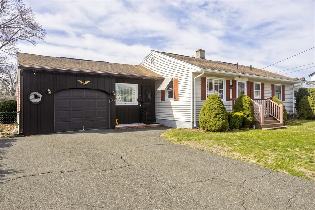 83 Mayflower Avenue Chicopee, MA 01013 - Photo 2 of 34 a front view of a house with garden