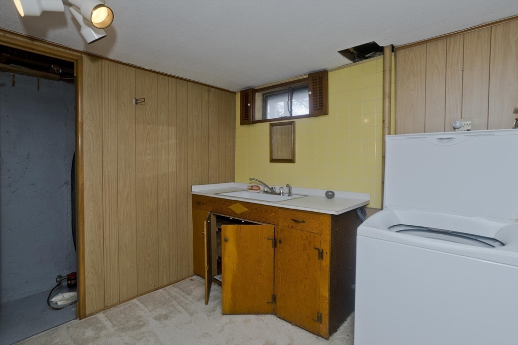 83 Mayflower Avenue Chicopee, MA 01013 - Photo 23 of 34 a utility room with dryer and washer