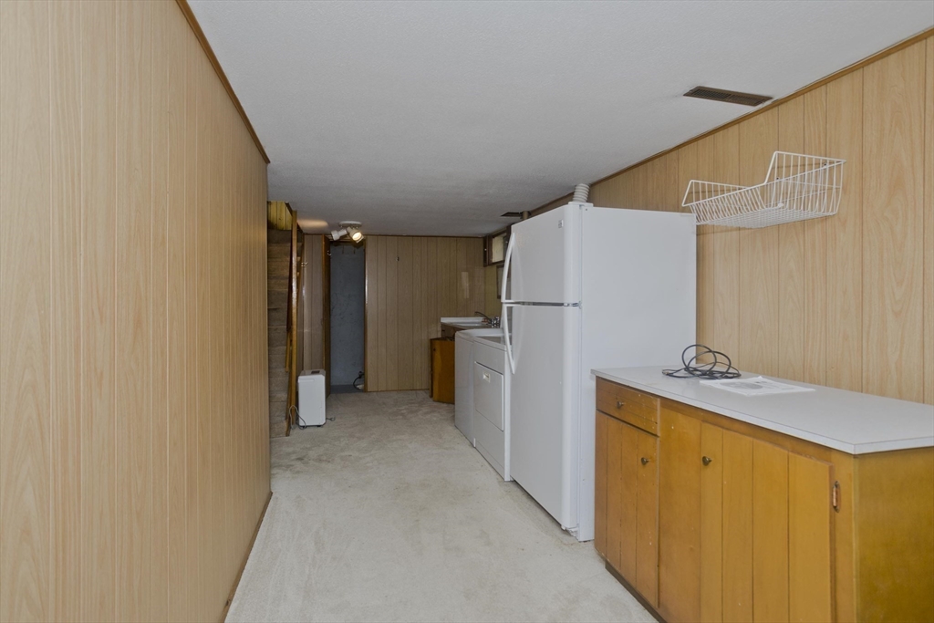 83 Mayflower Avenue Chicopee, MA 01013 - Photo 24 of 34 a view of a storage & utility room with a sink