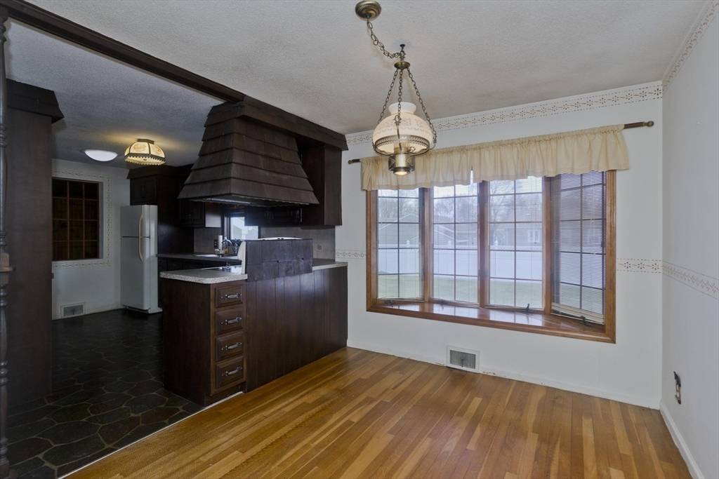 83 Mayflower Avenue Chicopee, MA 01013 - Photo 10 of 34 a open kitchen with stainless steel appliances granite countertop a stove and refrigerator