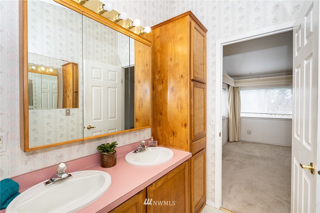 18039 Pendleton Street Southwest Rochester, WA 98579 - Photo 10 of 35 a bathroom with a sink a mirror and a shower